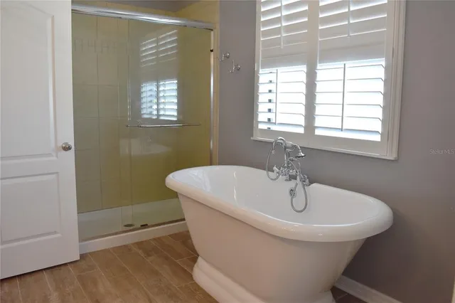 a white bath tub sitting next to a window