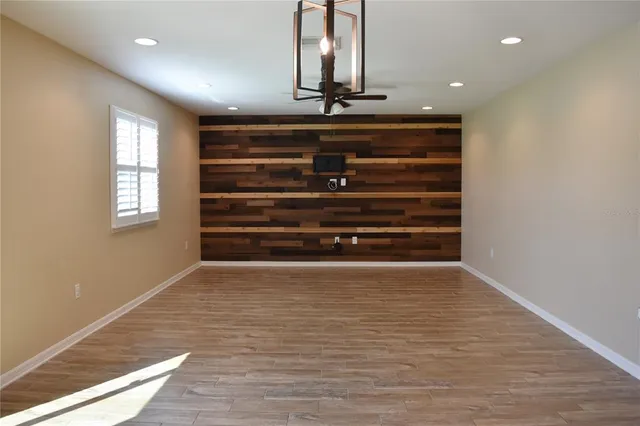 a view of room with wooden floor