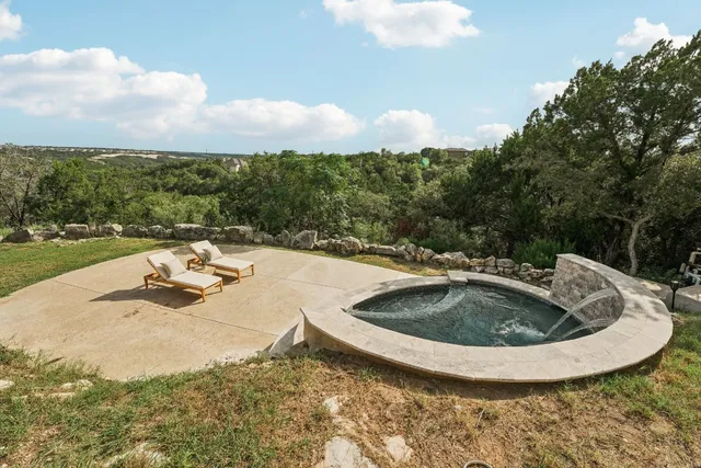 a view of a swimming pool with a yard