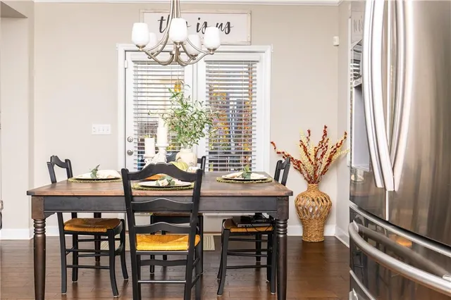 a view of a dining room with furniture and window