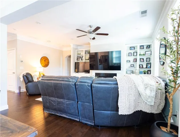 a living room with couch and a large window