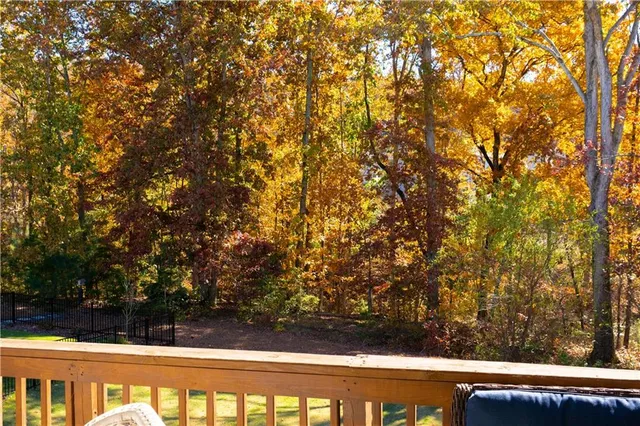 a view of balcony with wooden floor and yard