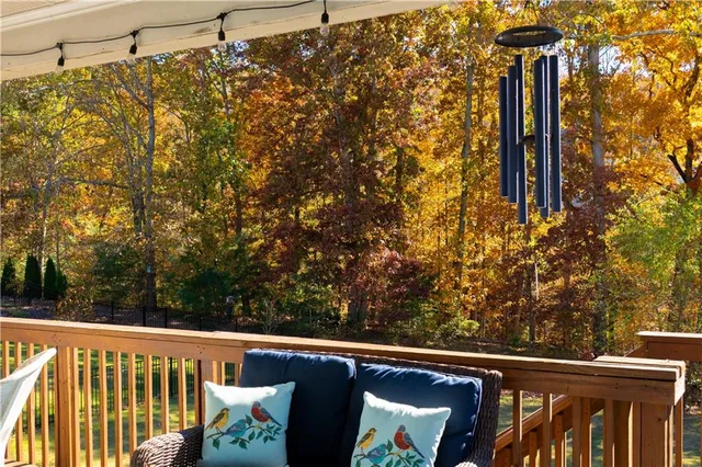 a view of a balcony with wooden fence and floor