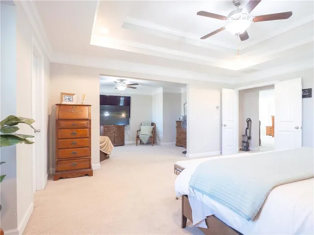 a bedroom with a bed and a walk in closet