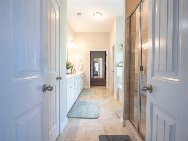 view of a bathroom with sink and shower