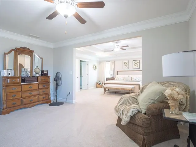 a bedroom with furniture and a mirror