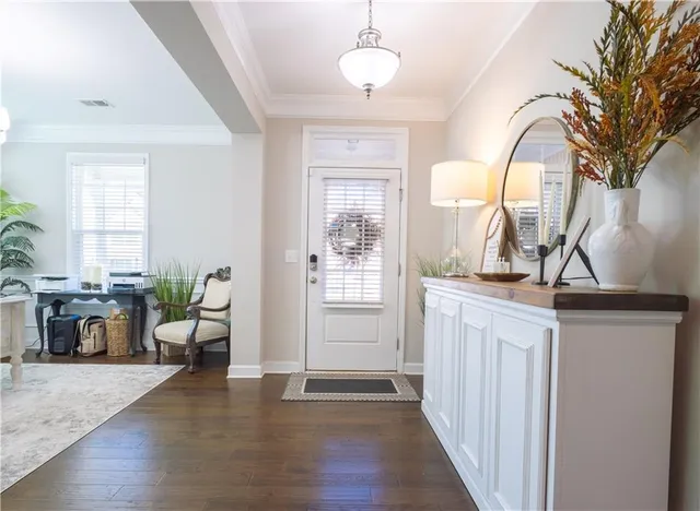 a view of a livingroom with furniture and hardwood floor