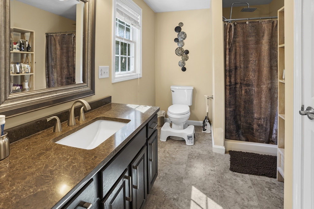138 Walnut Street Douglas, MA 01516 - Photo 22 of 32 a bathroom with a granite countertop sink and a mirror
