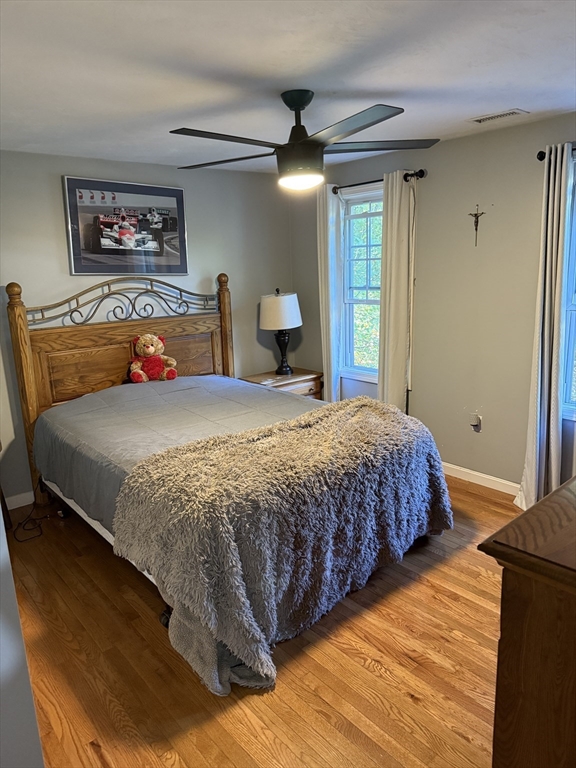 138 Walnut Street Douglas, MA 01516 - Photo 24 of 32 a bedroom with a bed and painting on the wall