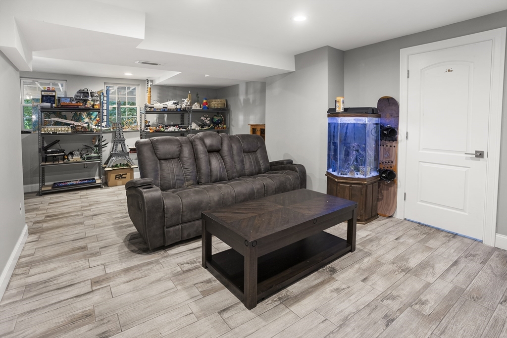 138 Walnut Street Douglas, MA 01516 - Photo 28 of 32 a living room with furniture and a wooden floor