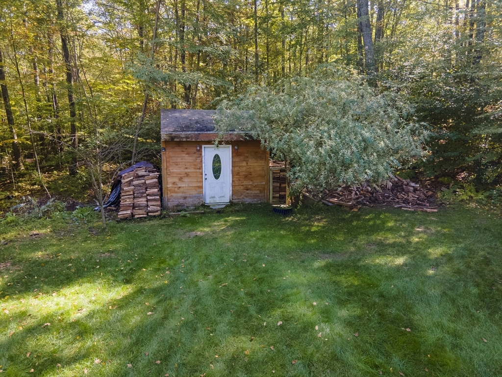 138 Walnut Street Douglas, MA 01516 - Photo 30 of 32 a front view of a house with a garden