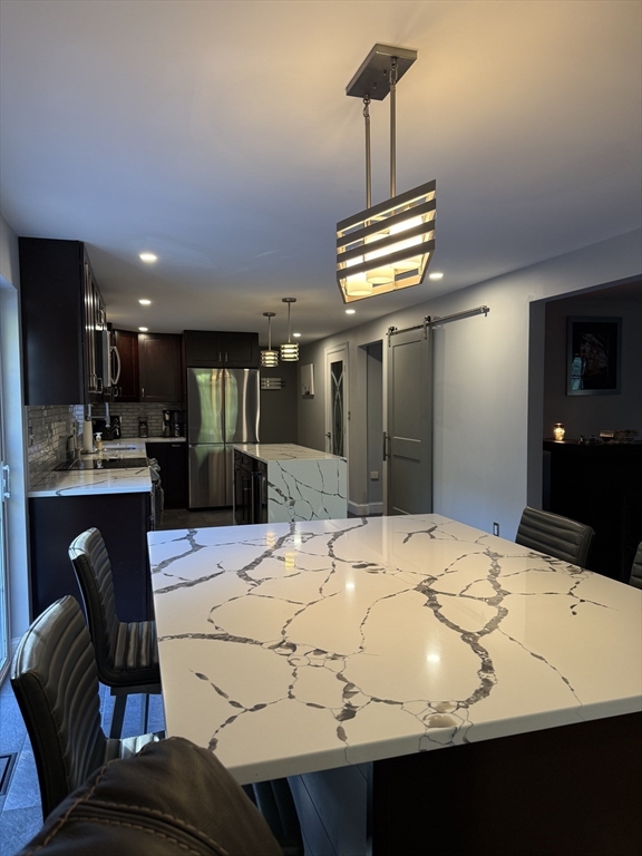 138 Walnut Street Douglas, MA 01516 - Photo 7 of 32 a view of kitchen with sink dining table and chairs