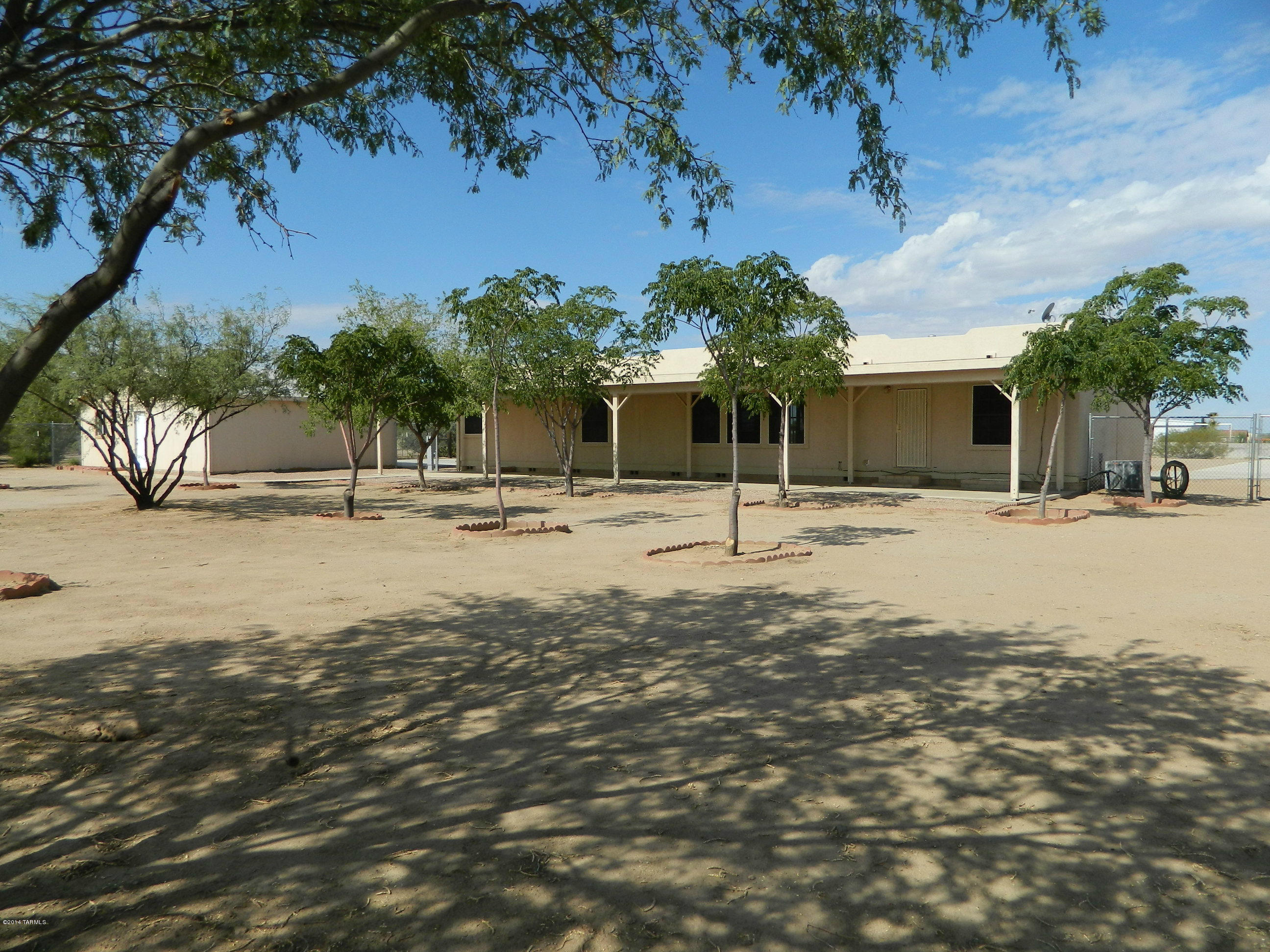 5204 North Puma Road Marana, AZ 85653 - Photo 35 of 36 a view of a houses with a yard