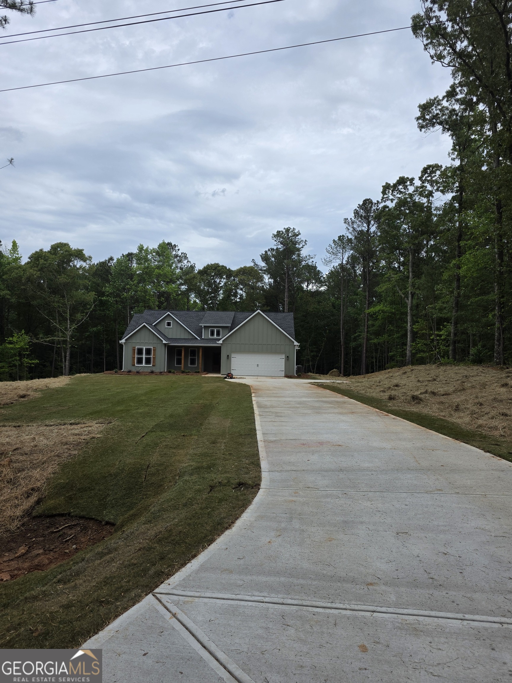 215 Panola Road Jackson, GA 30233 - Photo 2 of 16 a front view of a house with a yard
