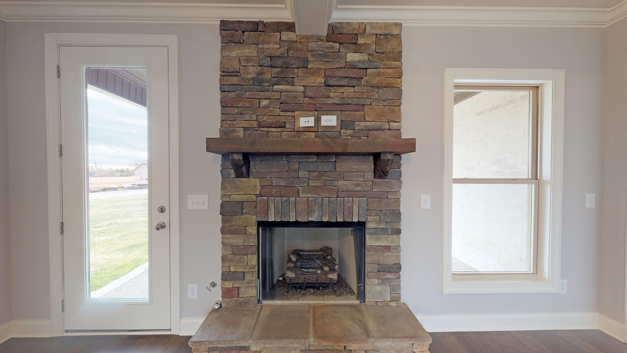 814 Ridgestone Place Lebanon, TN 37087 - Photo 4 of 16 a living room with a fireplace and a window