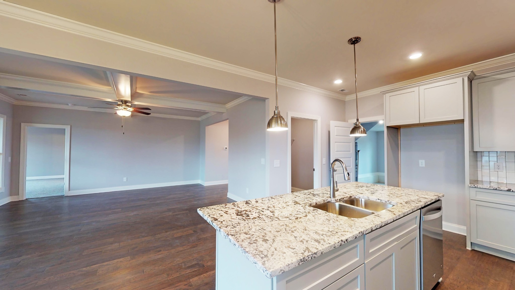 814 Ridgestone Place Lebanon, TN 37087 - Photo 7 of 16 a kitchen with kitchen island white cabinets and refrigerator