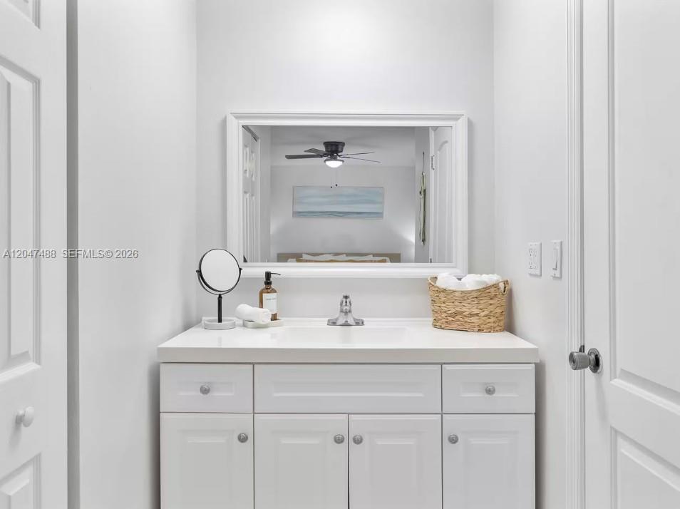 9840 Southwest 3rd Street Miami, FL 33174 - Photo 18 of 25 a bathroom with a sink and a mirror