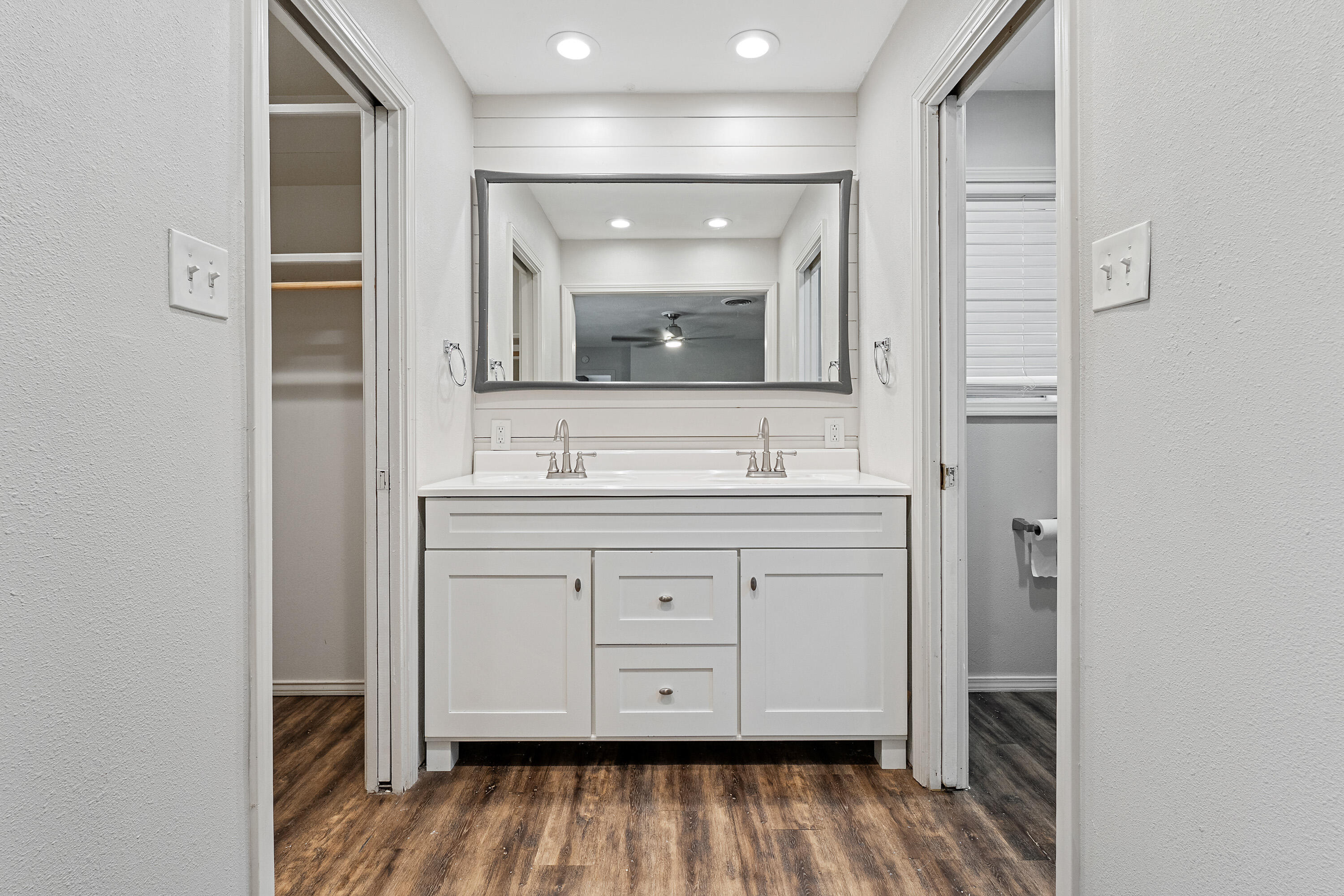 4113 62nd Drive Lubbock, TX 79413 - Photo 18 of 29 a bathroom with a sink and a mirror