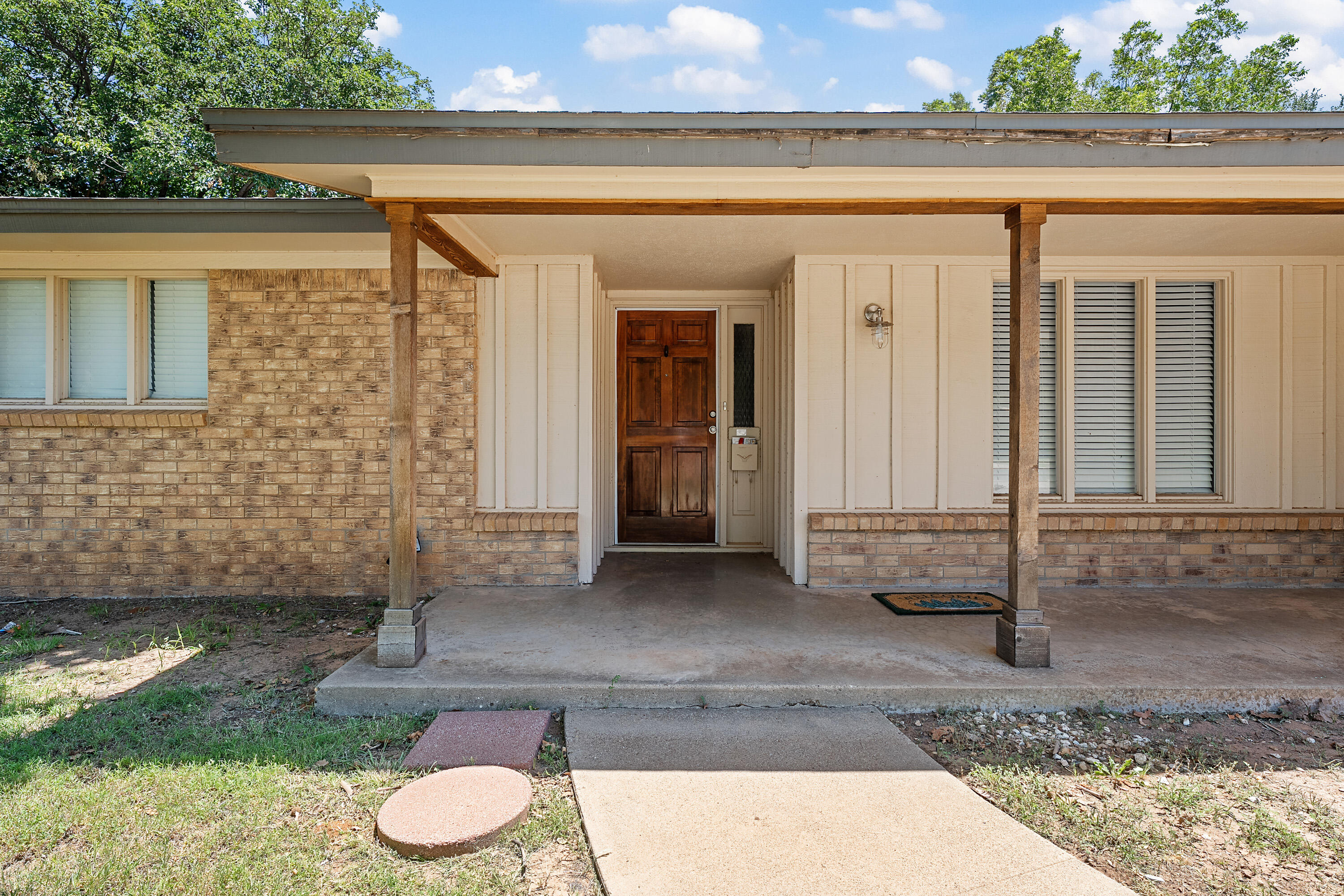 4113 62nd Drive Lubbock, TX 79413 - Photo 3 of 29 a front view of a house with porch