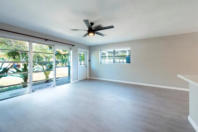 a view of n empty room with windows