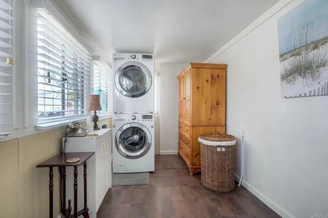 a view of a storage and utility room with washer and dryer