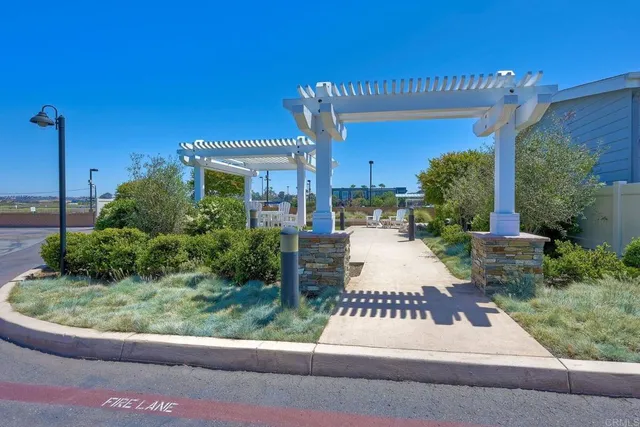 a view of a backyard with sitting area