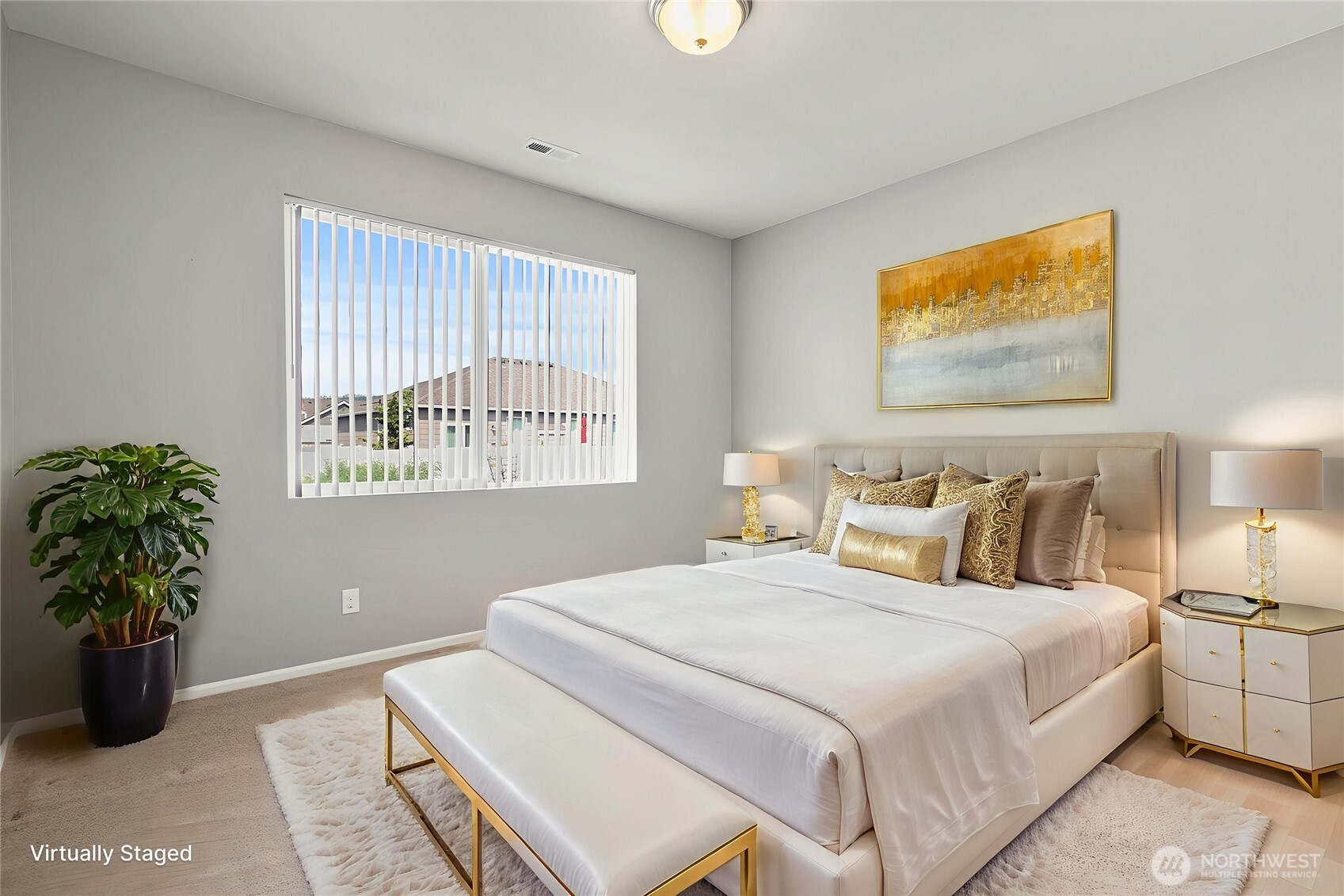 103 Hickory Avenue Southwest, Unit 35 Orting, WA 98360 - Photo 15 of 38 a bedroom with bed and a potted plant