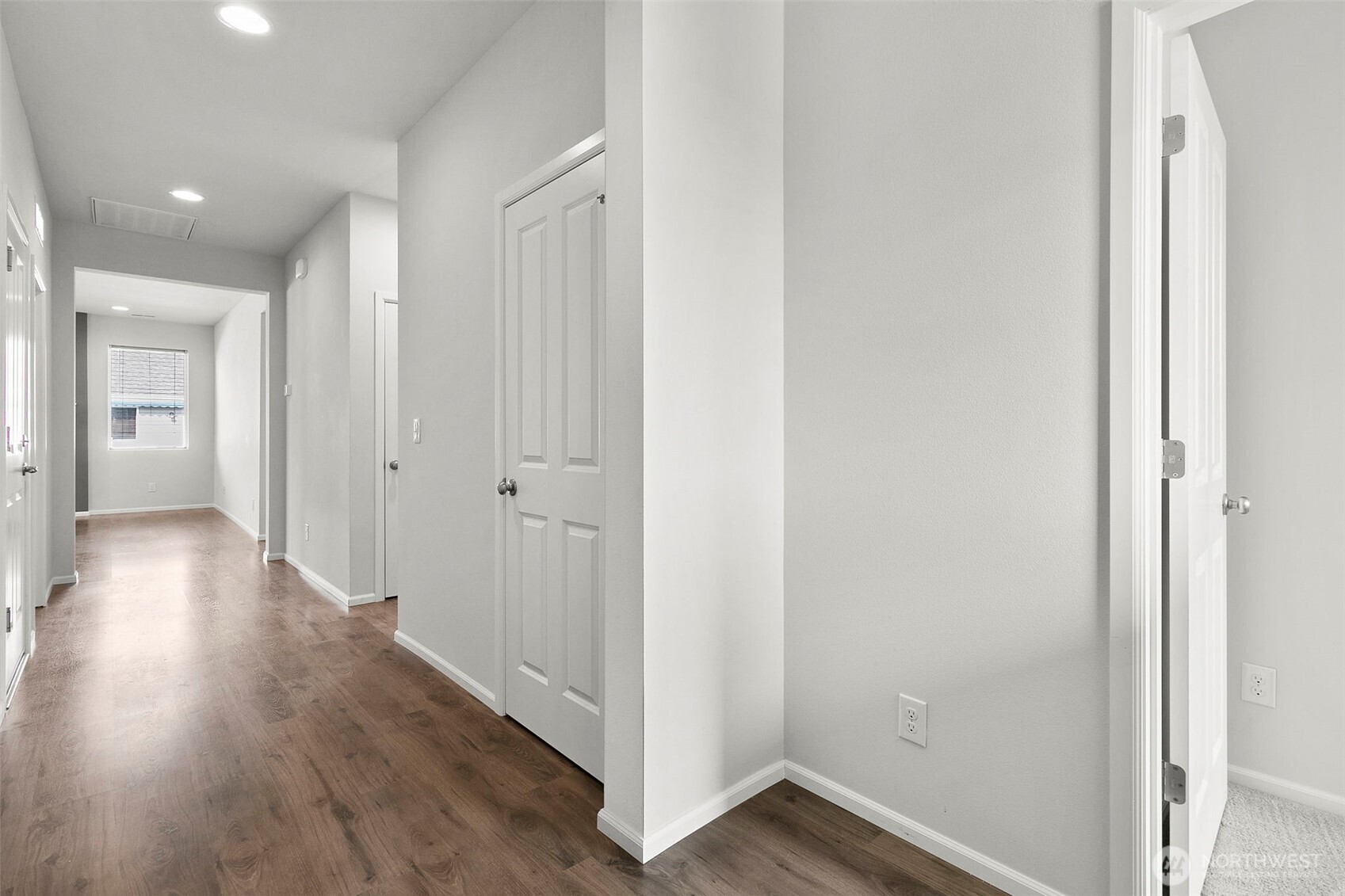 103 Hickory Avenue Southwest, Unit 35 Orting, WA 98360 - Photo 23 of 38 a view of a hallway with wooden floor