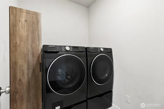 a utility room with dryer and washer