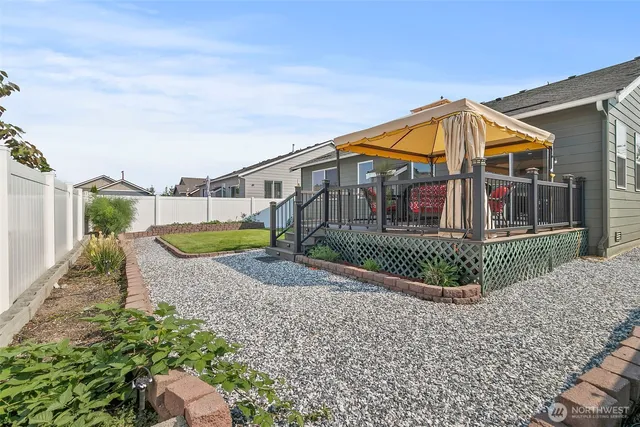 a view of a house with a small yard and plants