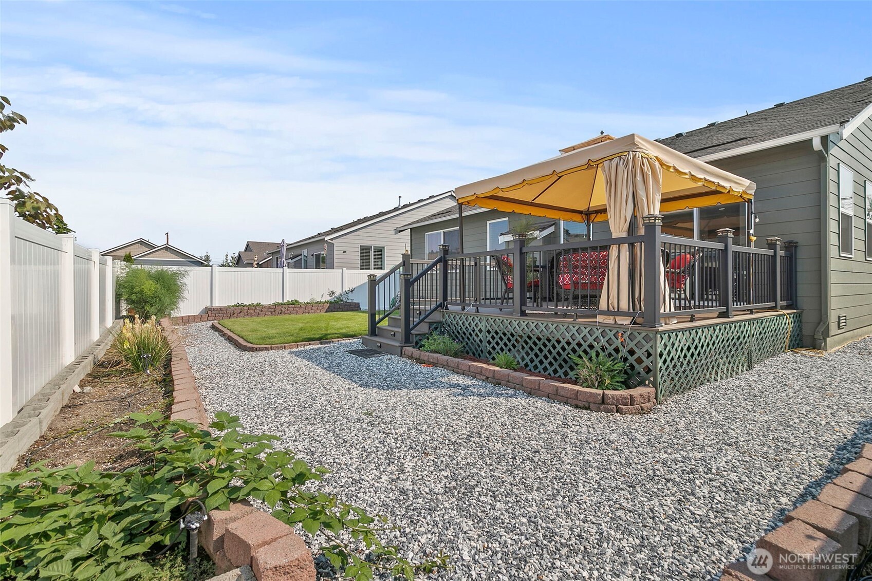 103 Hickory Avenue Southwest, Unit 35 Orting, WA 98360 - Photo 25 of 38 a view of a house with a small yard and plants
