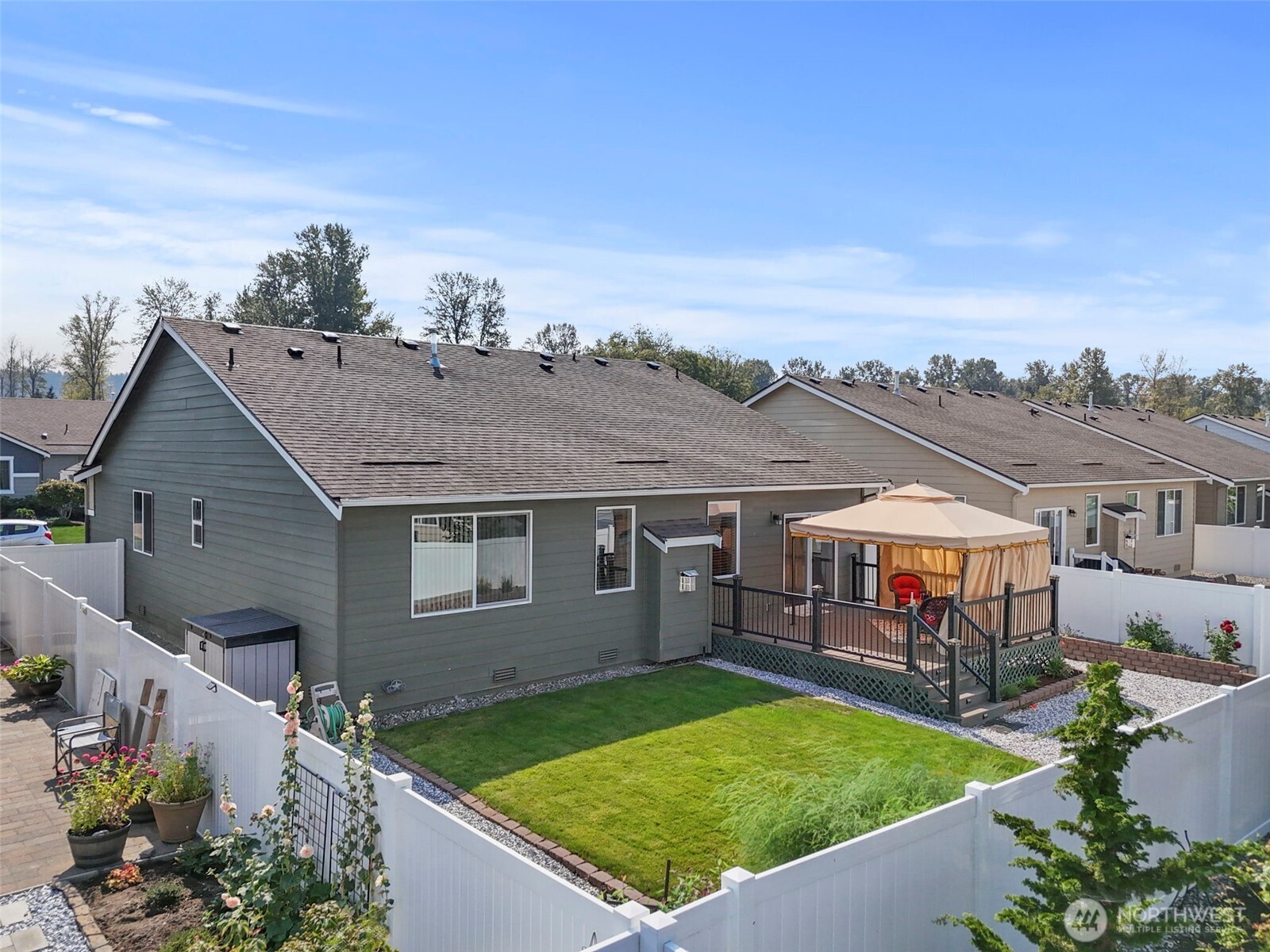 103 Hickory Avenue Southwest, Unit 35 Orting, WA 98360 - Photo 28 of 38 an aerial view of a house having yard patio and fire pit