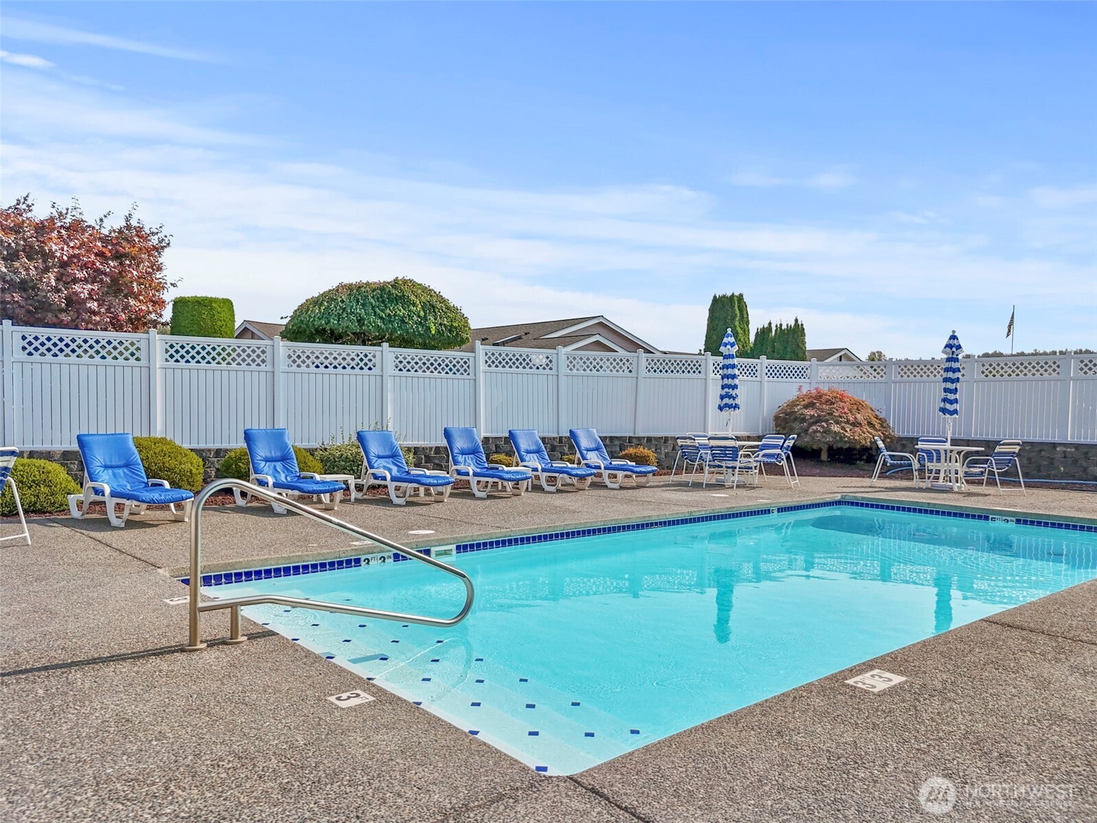103 Hickory Avenue Southwest, Unit 35 Orting, WA 98360 - Photo 31 of 38 a view of a swimming pool and lounge chairs