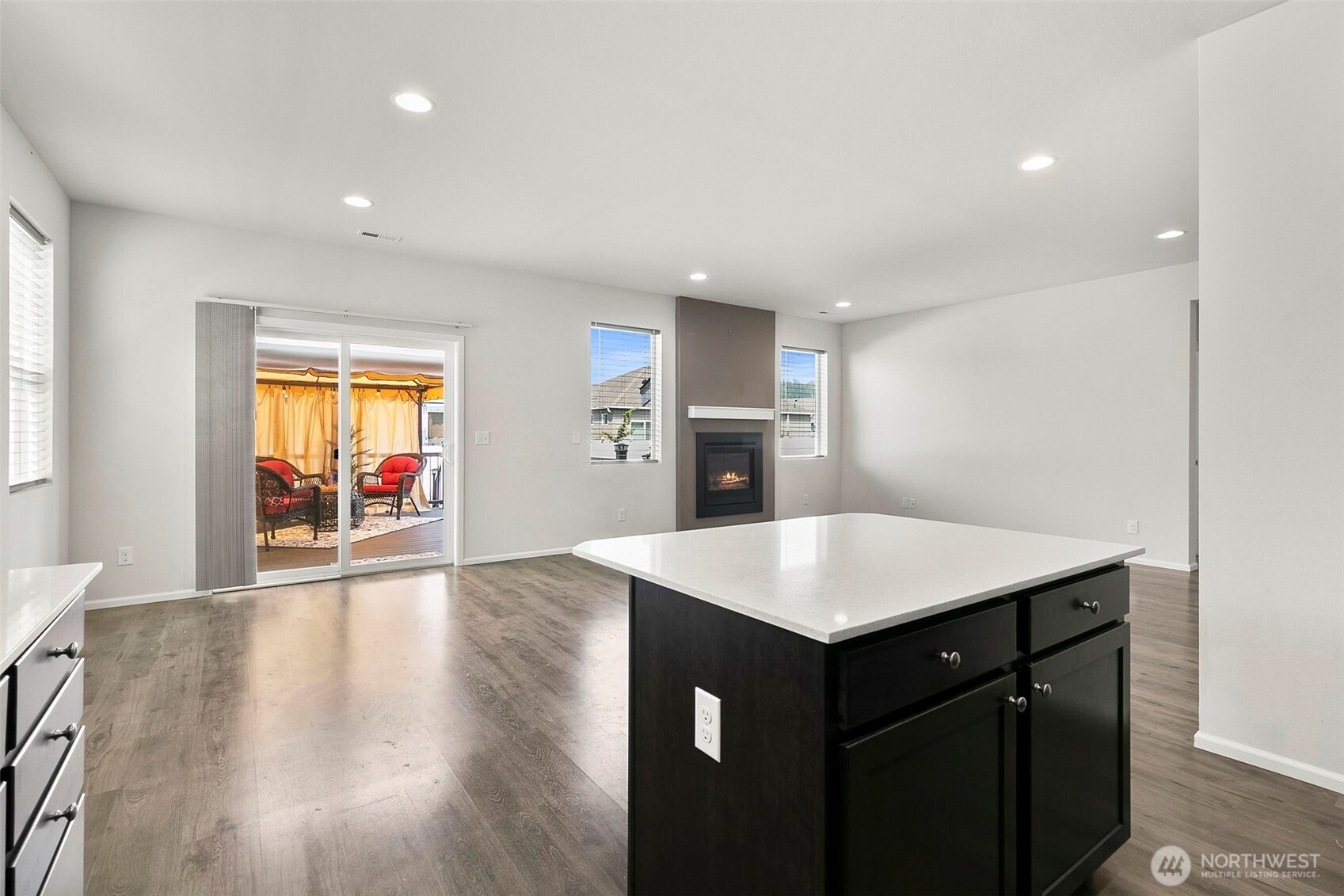 103 Hickory Avenue Southwest, Unit 35 Orting, WA 98360 - Photo 5 of 38 a kitchen with a wooden floor and a window