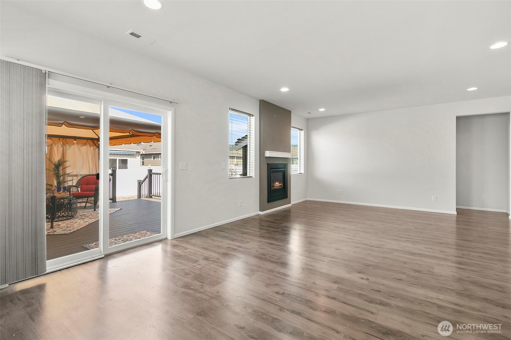103 Hickory Avenue Southwest, Unit 35 Orting, WA 98360 - Photo 10 of 38 a view of empty room with wooden floor