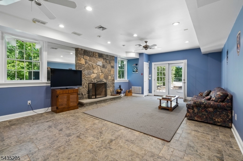12 Oak Hill Road Bernards, NJ 07920 - Photo 24 of 33 a living room with furniture and a flat screen tv