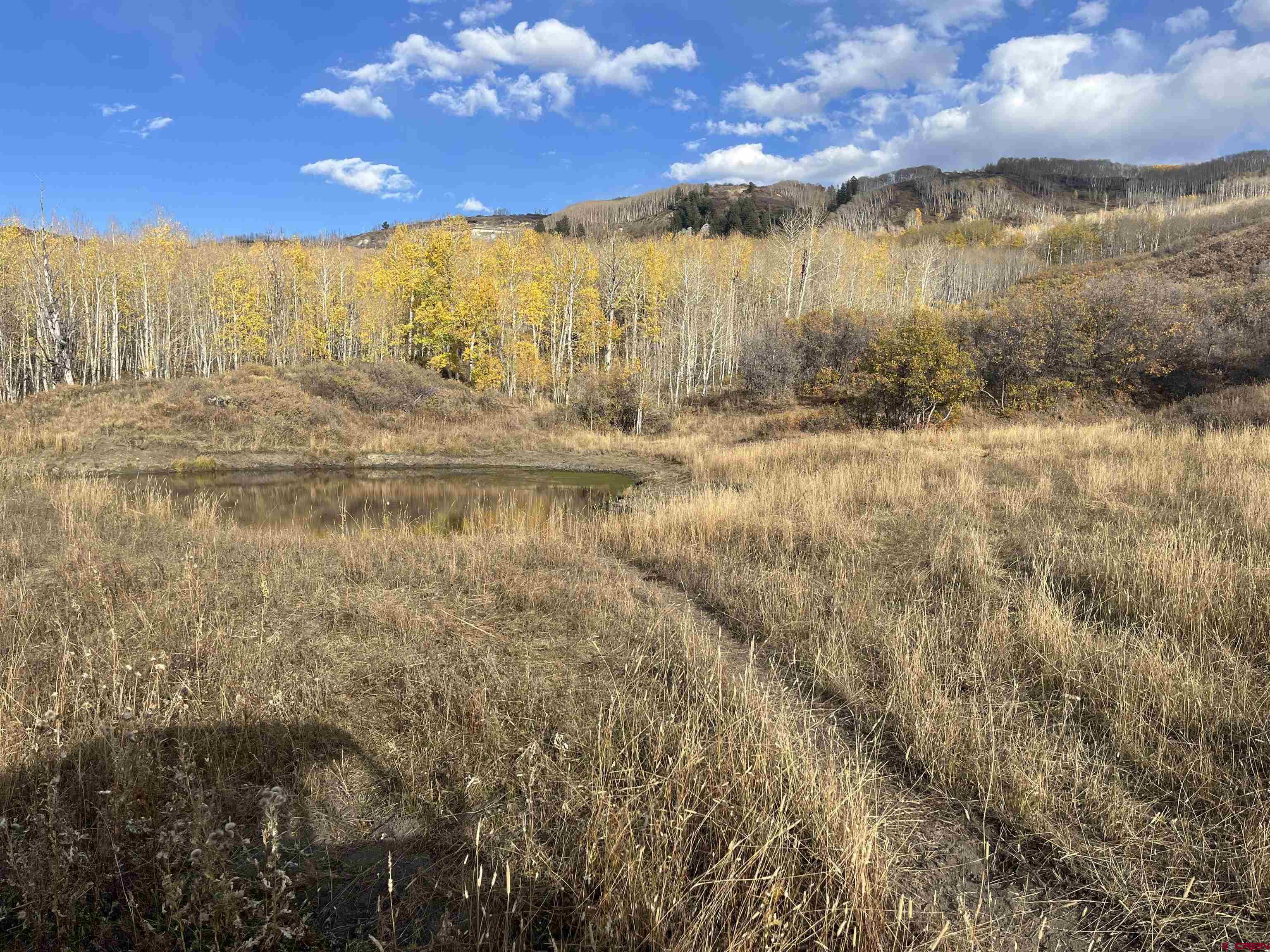 Tbd Q 72 Road Montrose, CO 81401 - Photo 3 of 12 a view of water with an outdoor space