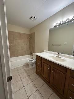 2240 Tarpley Road, Unit 433 Carrollton, TX 75006 - Photo 13 of 14 a bathroom with a double vanity sink mirror and toilet