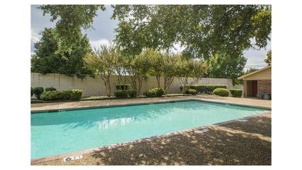 2240 Tarpley Road, Unit 433 Carrollton, TX 75006 - Photo 2 of 14 a view of a swimming pool with a patio