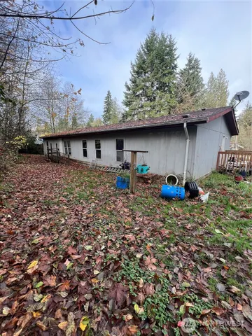 a backyard of a house with lots of green space