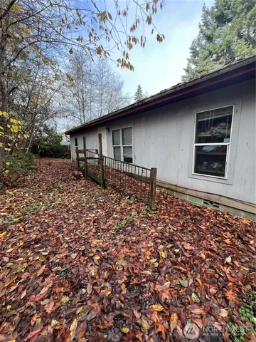 a backyard of a house with lots of green space
