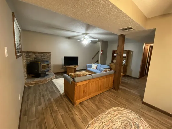 a living room with a couch and a fireplace