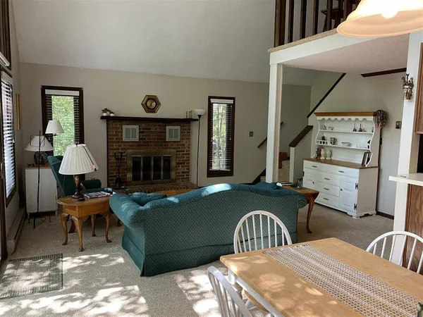 a bedroom with furniture and a fireplace