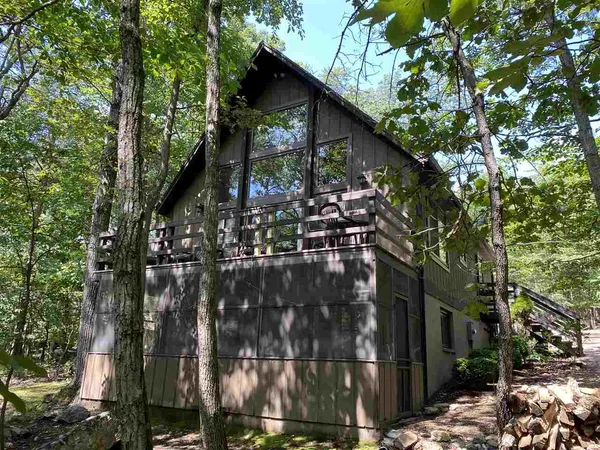 a view of a house with a tree