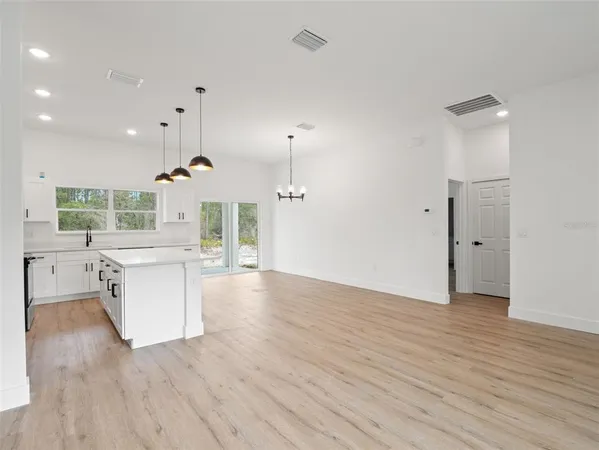 a view of a kitchen with a sink and a window