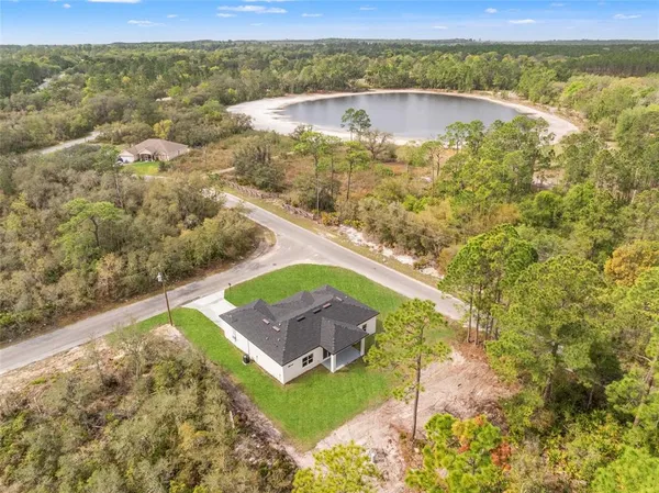 a view of a lake with a yard