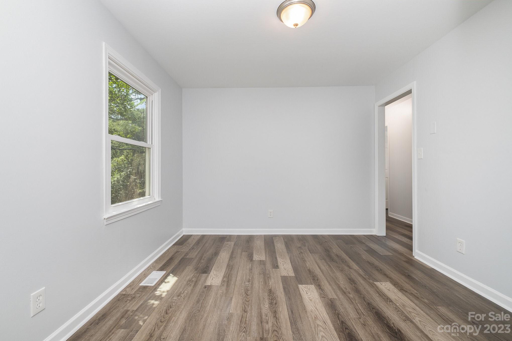 6364 Monteith Drive Charlotte, NC 28213 - Photo 13 of 35 a view of room with window and hardwood floor