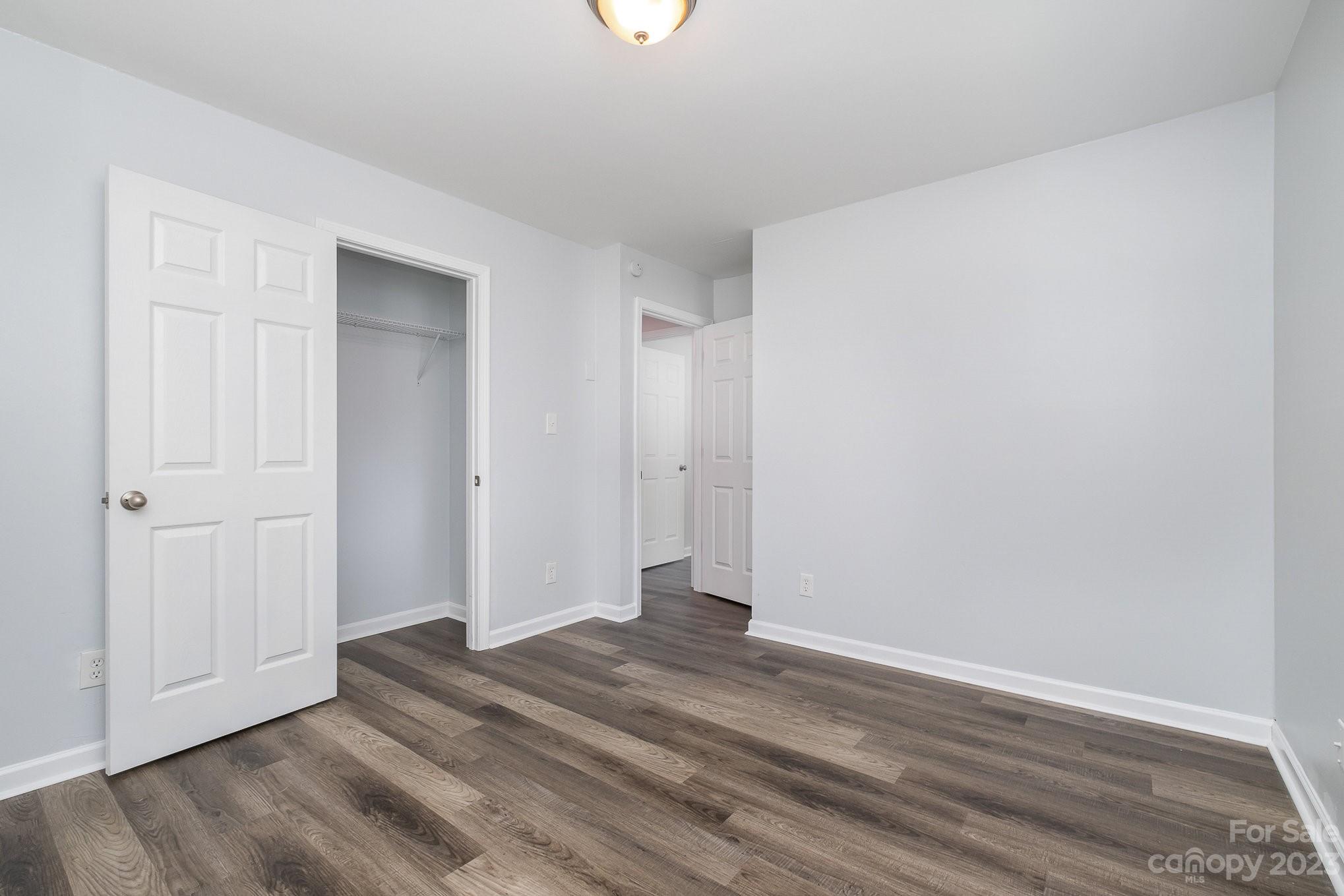 6364 Monteith Drive Charlotte, NC 28213 - Photo 28 of 35 a view of an empty room with wooden floor
