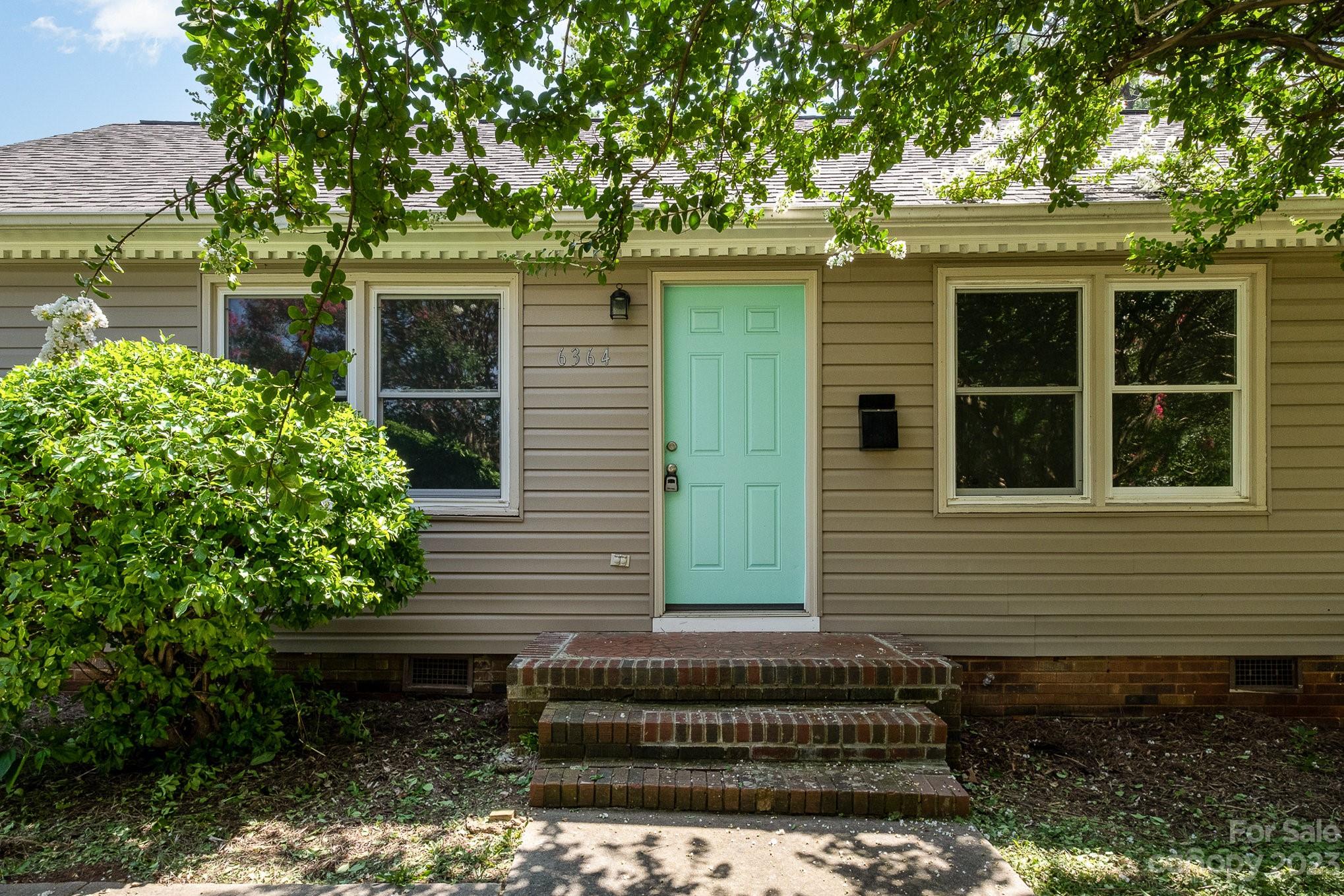 6364 Monteith Drive Charlotte, NC 28213 - Photo 7 of 35 a front view of a house with a garden
