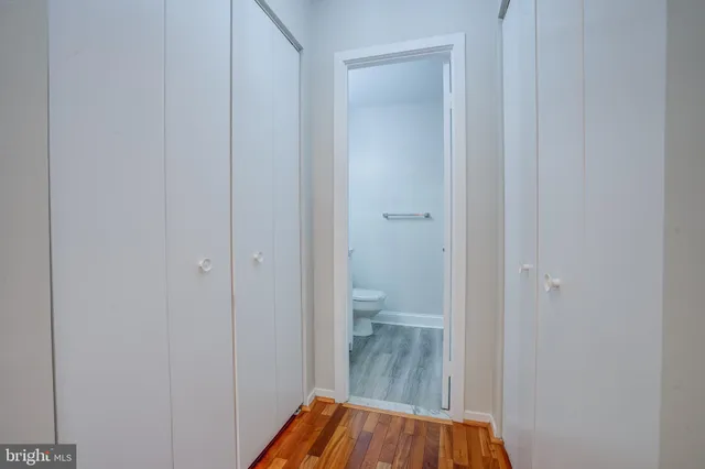 a view of a bathroom from a hallway